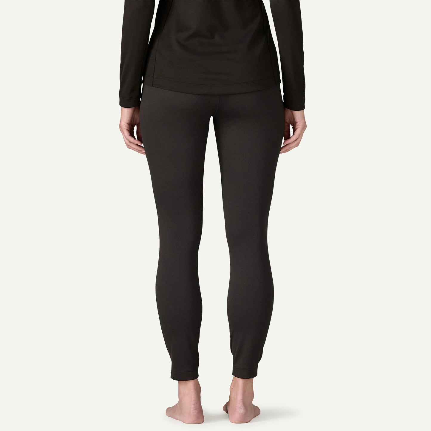 malla térmica Patagonia Capilene Midweight Bottoms mujer color Black vista trasera